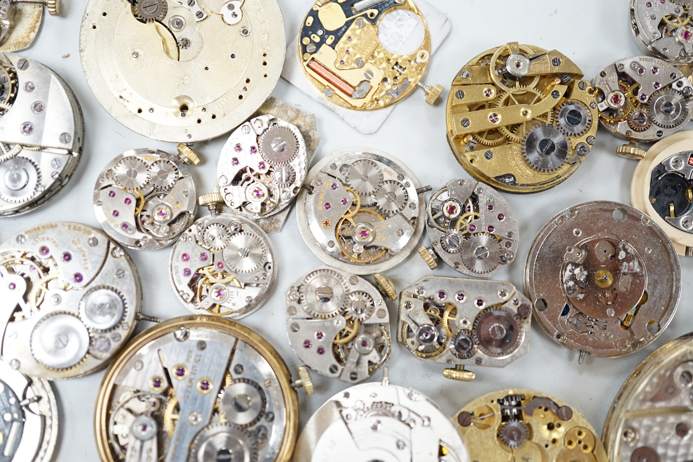 A quantity of assorted wrist and pocket watch parts and movements.